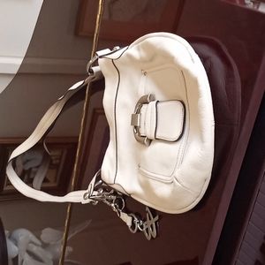 Handbag designer  B Makowsky color cream